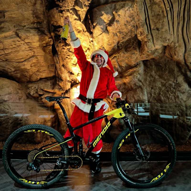 7 Santa with a full suspension mountain bike