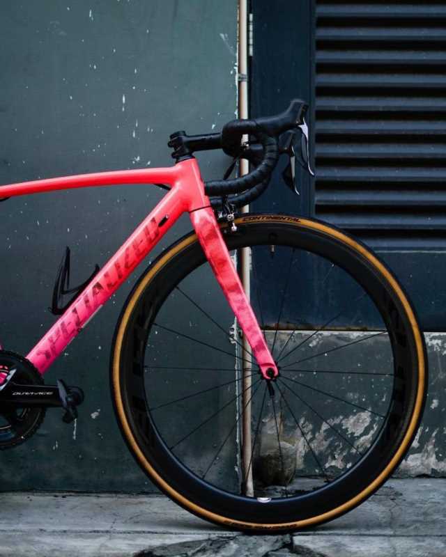 12 A pink Specialized rim brake superbike with dura-ace
