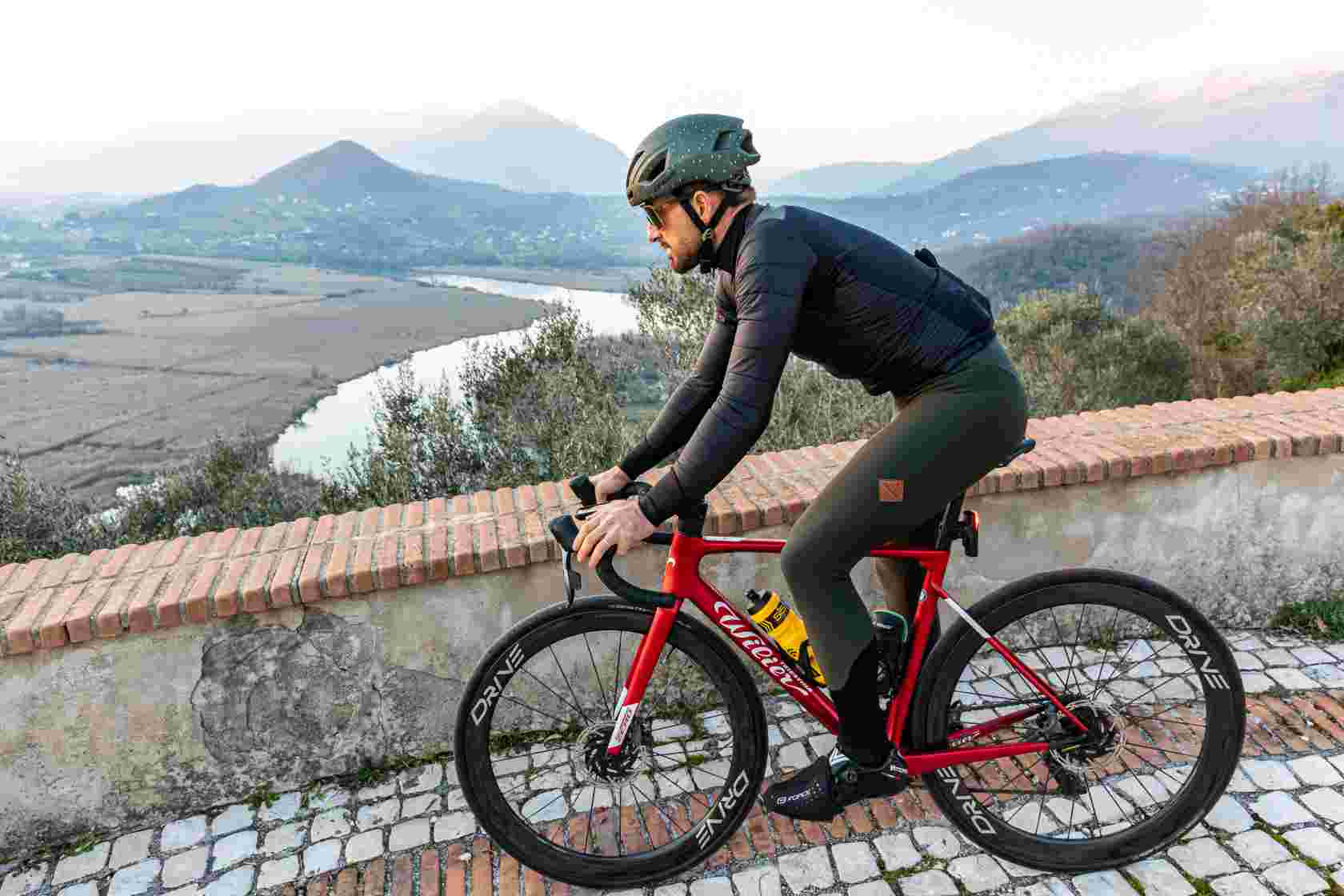 A Cyclist Riding a Wilier Road Bike With Elitewheels Drive 50 in Italy