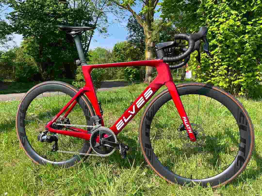 A Vibrant Red ELVES Road Bike with Aero Wheels