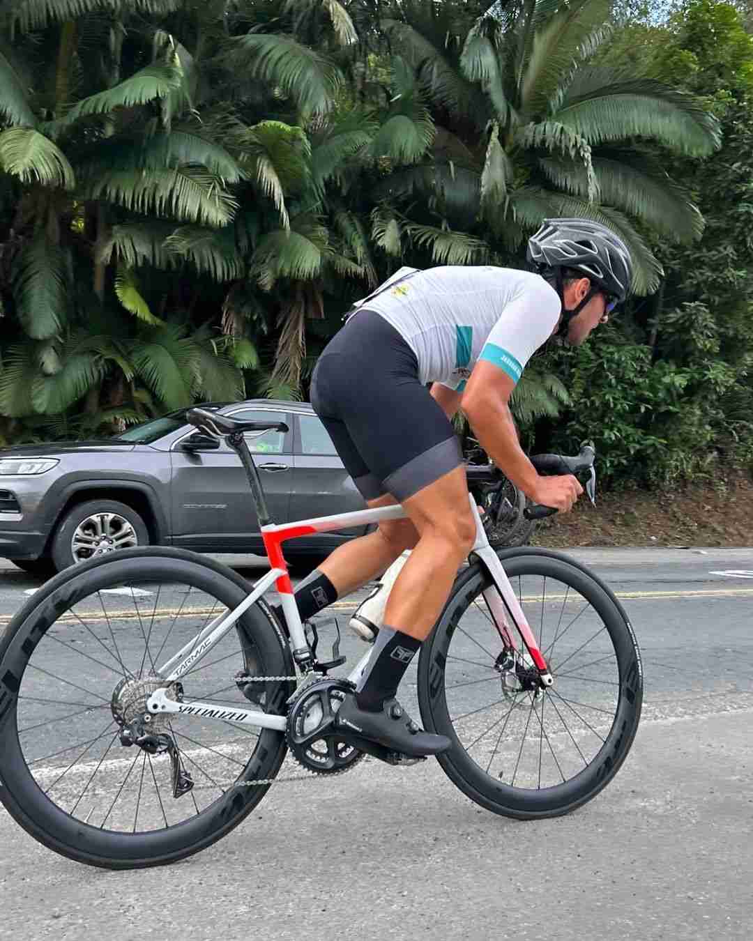 Cyclist Riding a Specialized Tarmac Bike with Elitewheels Marvel 50D Wheelsets on a Scenic Road